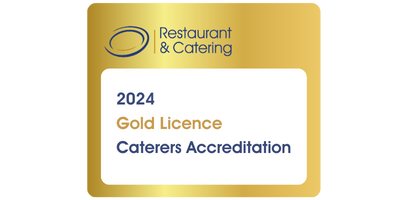 The image shows a circular badge with a gold background and text that reads
